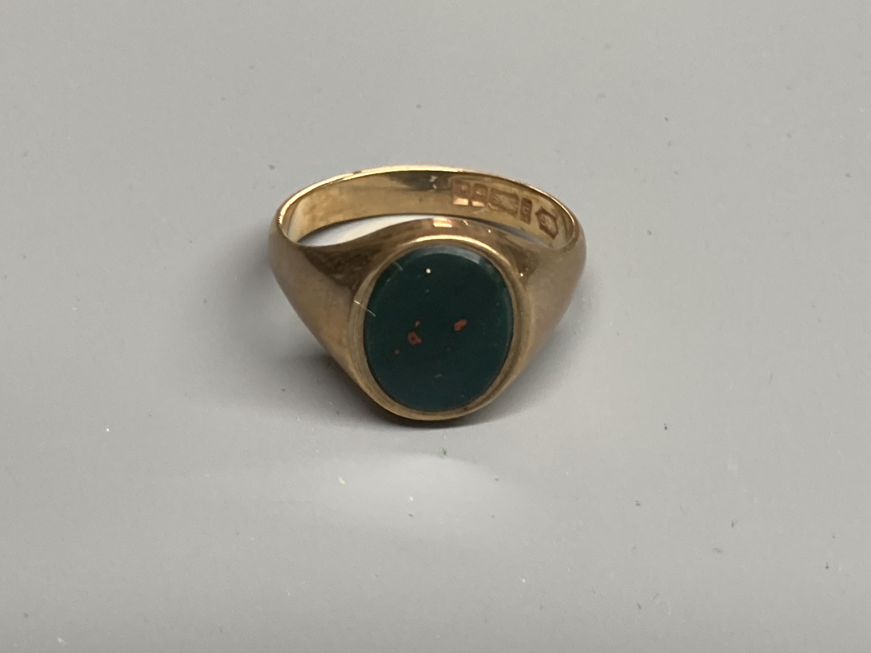 Two modern 9ct gold and bloodstone set signet rings, sizes M & T and a 9ct gold and hematite ring, size S/T